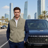 Cavaliére Unisex Microfleece Zip Vest in muted olive tone with high collar, styled over smart casual attire outdoors