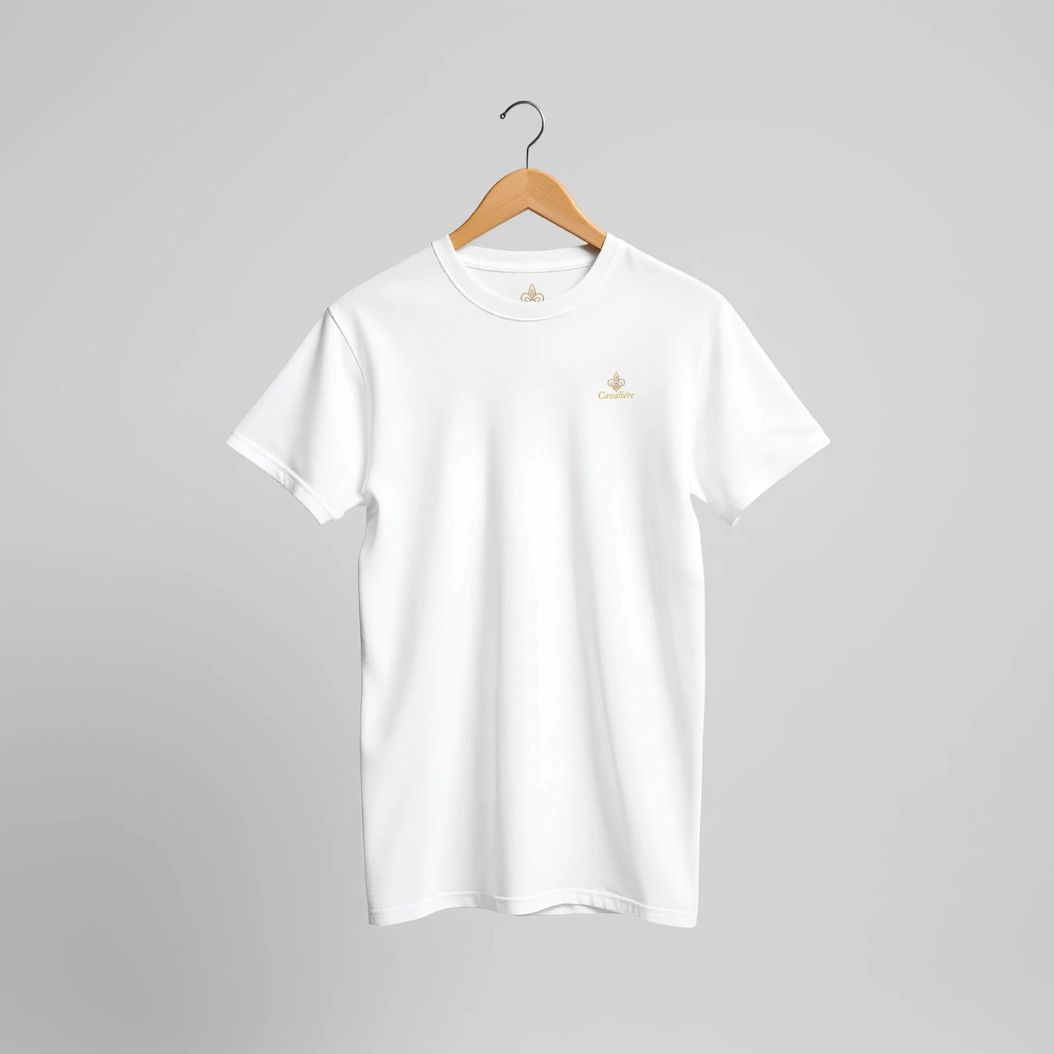 Premium Unisex Crewneck T-shirt | Cavaliére in classic white with subtle logo embroidery on chest, displayed on wooden hanger