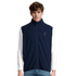 Cavaliére Unisex Microfleece Zip Vest in navy with stand-up collar and discreet embroidered logo on chest, worn over white long sleeve shirt